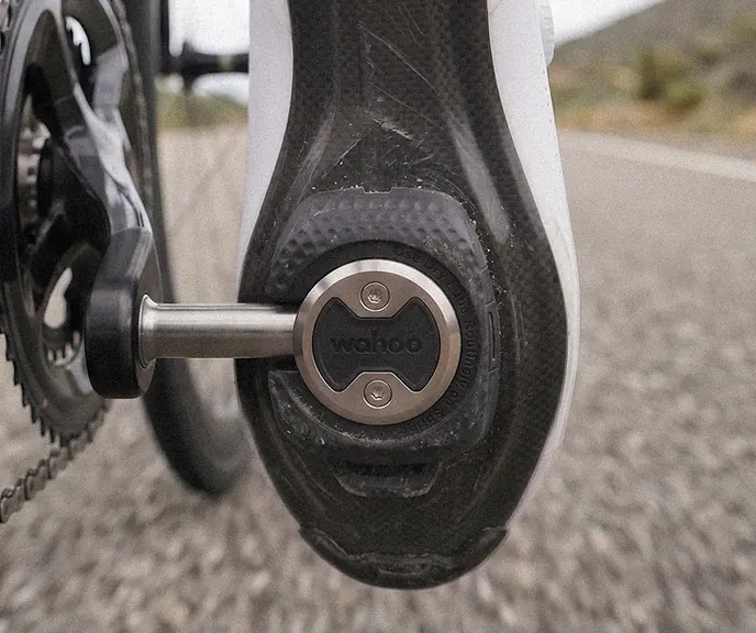 A rider pedalling on SPEEDPLAY road pedals, the road blurring past